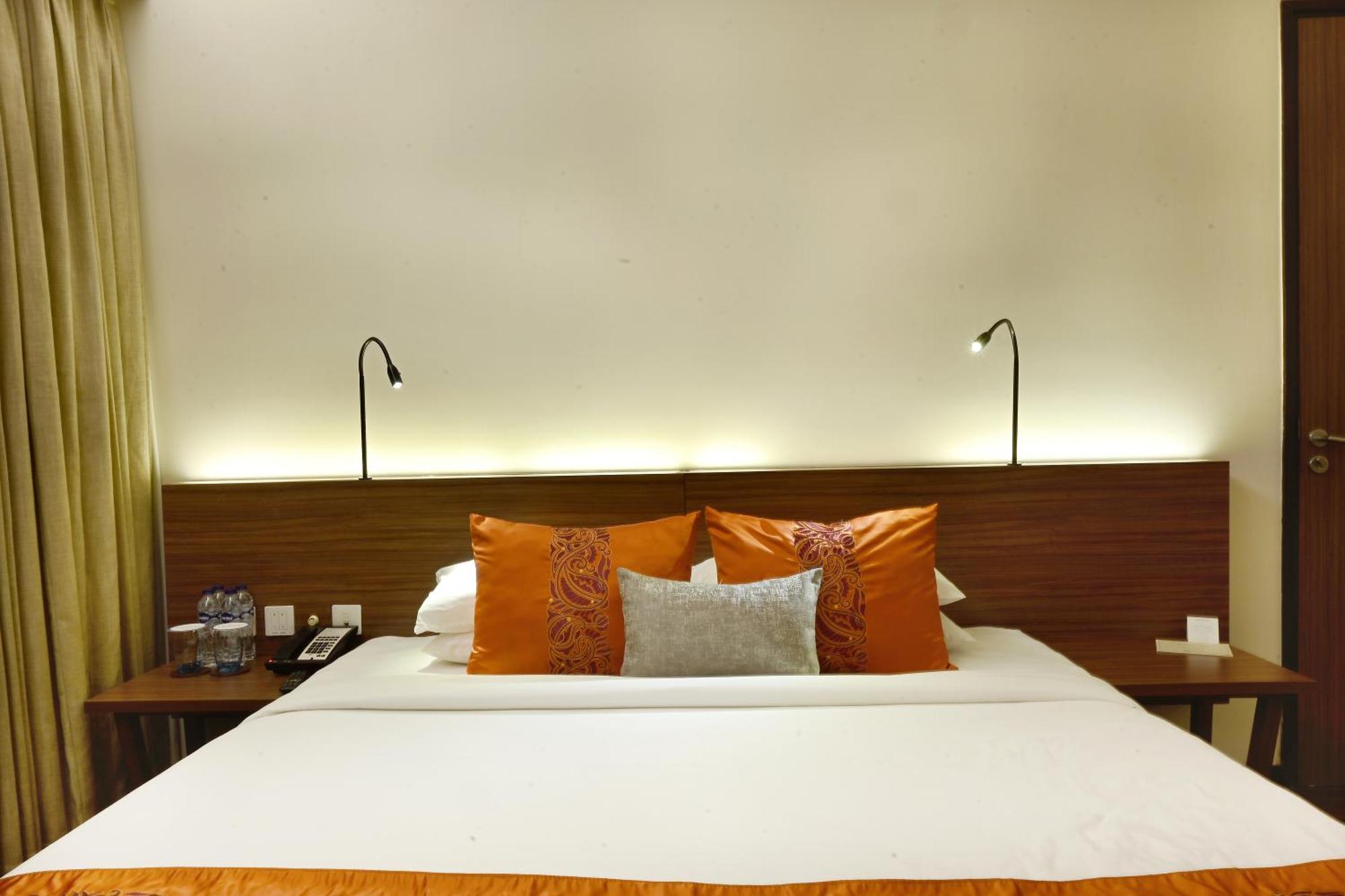 Vivanta Kolkata Em Bypass Extérieur photo A bed in a hotel room